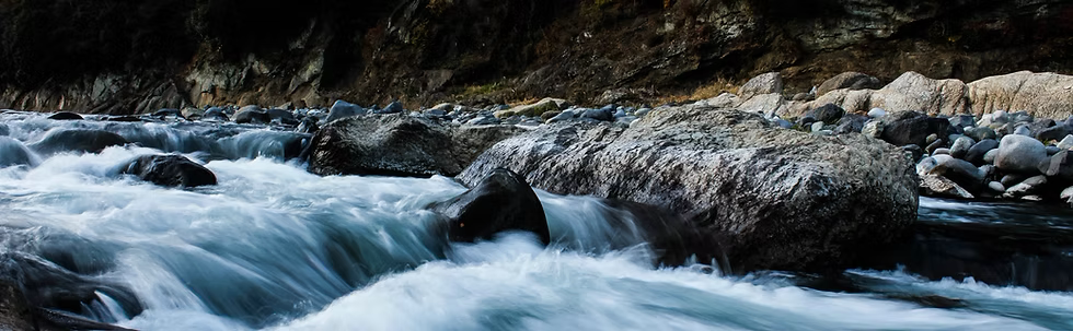 Image of river flowing around rocks
